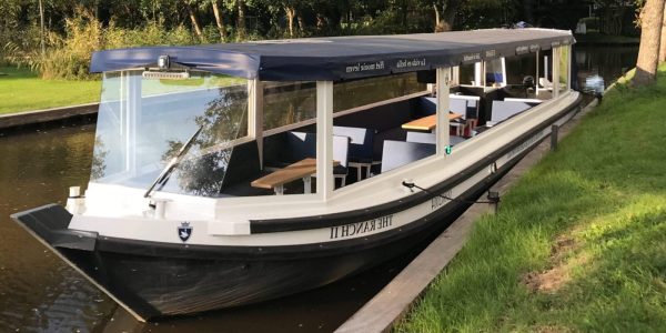 Luxury covered canal boat for tours in Giethoorn