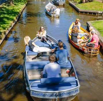 Families enjoying boat tours on Giethoorn canals