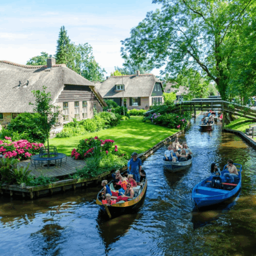 Boats with tourists on scenic Giethoorn canal